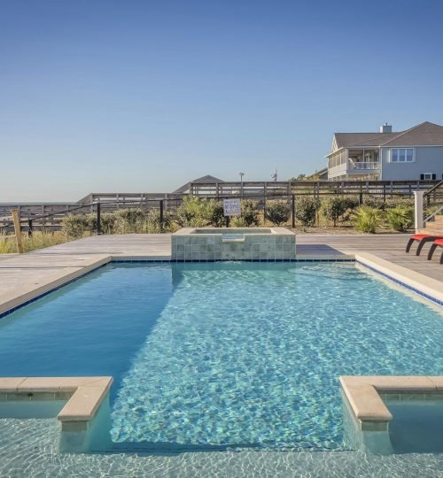Stunning infinity pool at a seaside resort, perfect for relaxation and leisure travel.